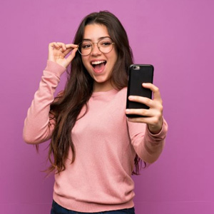 Confident young woman taking a selfie