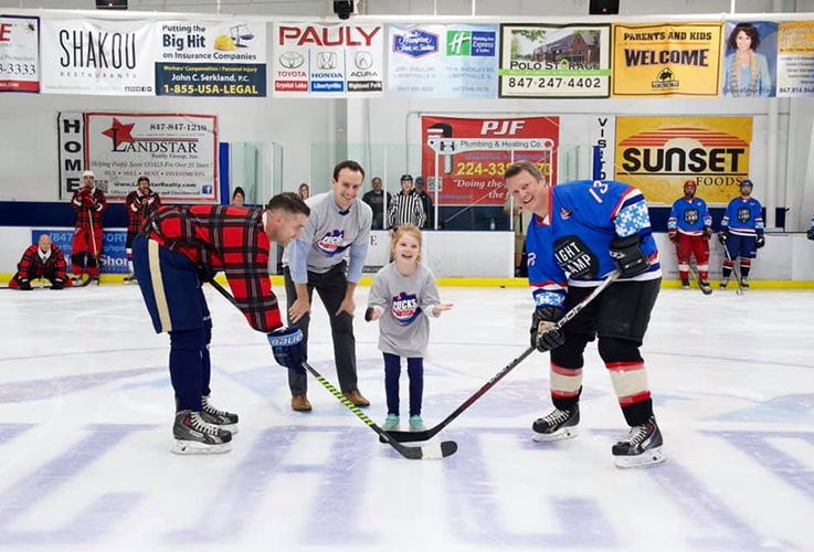 Dental team members at Pucks for Autism event