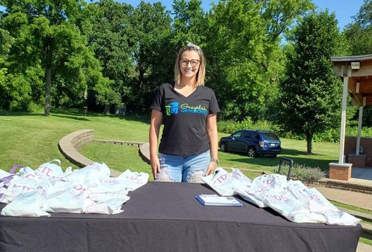 Orthodontic team member at information desk at Grayslake Park Disctrict community event