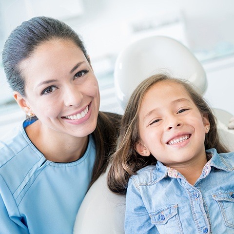 Mother and daughter smiling during phase one orthodontic treatment visit