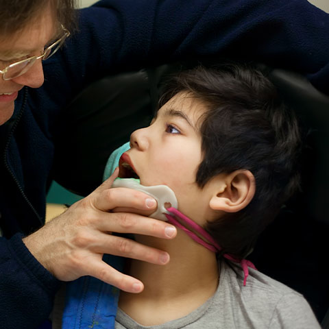 Orthodontist treating special needs dental patient