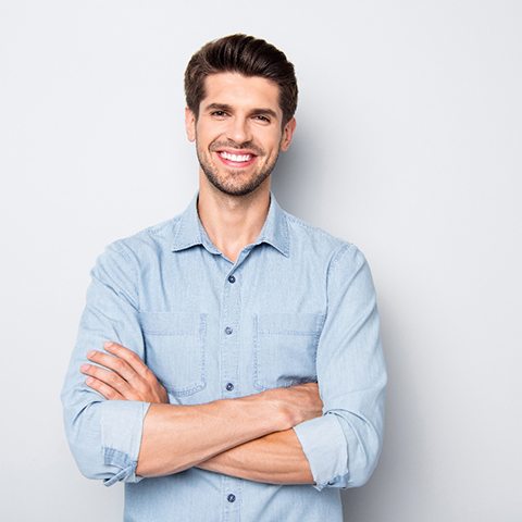 Handsome, smiling man against neutral background