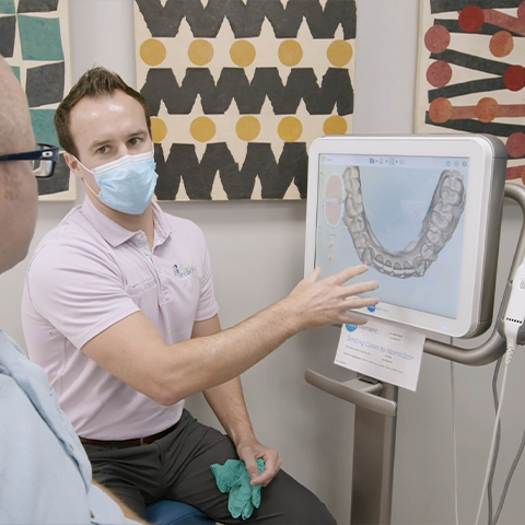 Orthodontist using iTero integrated Invisalign treatment system
