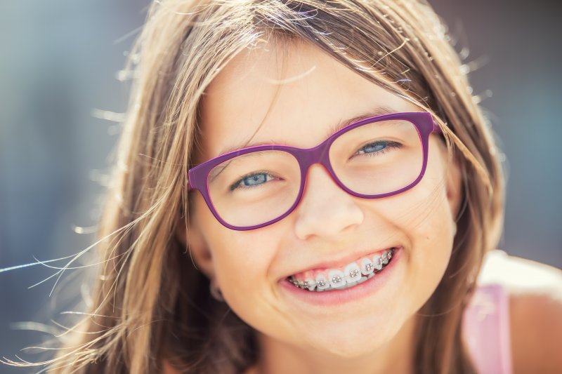 young girl with braces