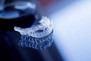 a pair of Invisalign aligners on a table