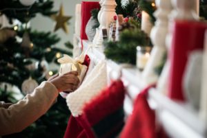 a stocking containing a wrapped Christmas gift